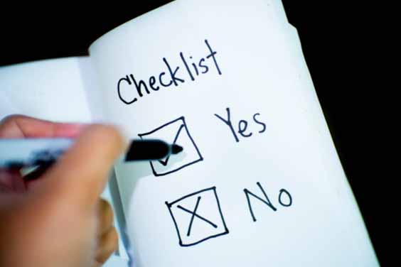 A person marking a checklist